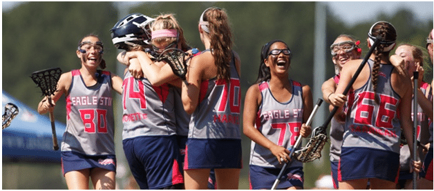 Girls lacrosse team celebrating